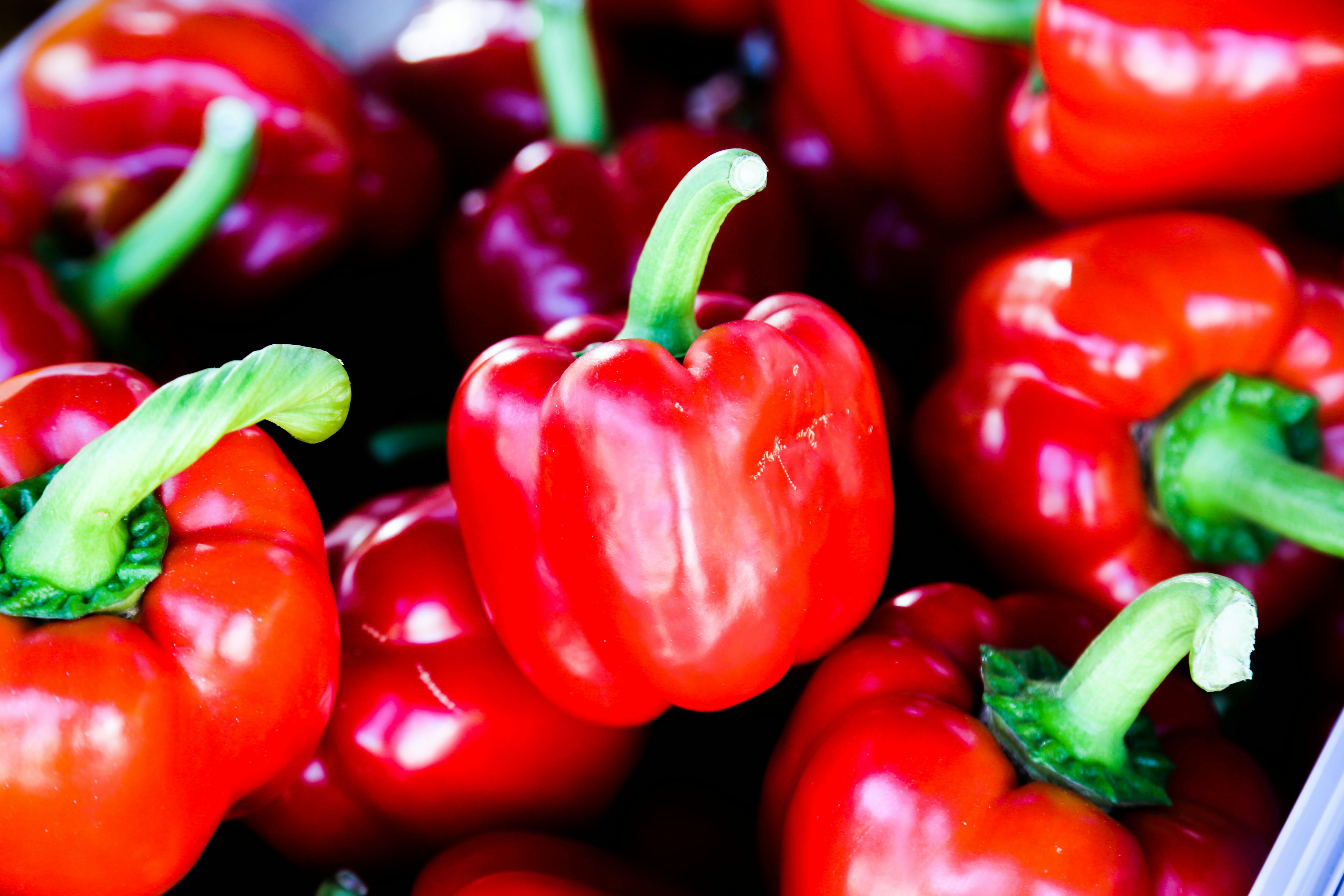 bunch of red bell peppers